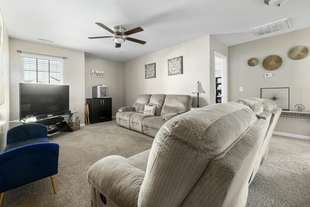Bright and modern living room with minimalist interior design and cozy decor.